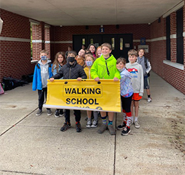 Group of Students with Walking School banner