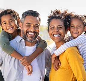 Parents with kids smiling
