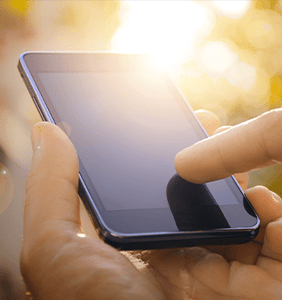 Hands using a mobile device