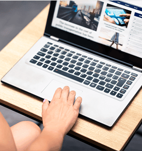 Laptop open to a news website