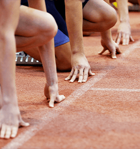 Athletes lining up at the starting line