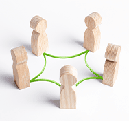 little wooden figures standing in a circle