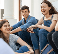 students sitting and laughing together