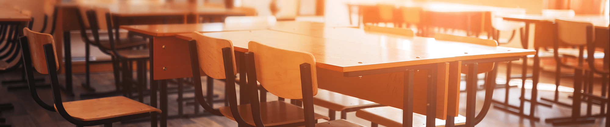 Classroom with empty desks as the sun sets