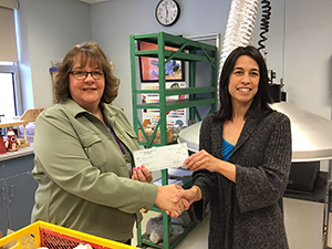 Coudersport Area School District Sarah Batson receives her grant from Superintendent Jackie Canter.