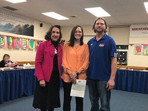 Mountain View’s grant recipient, Jamie White, pictured in the middle. Left is Superintendent Karen K. Voigt. To the right is Jason Richmond, School Board President.