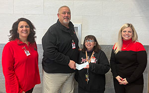 Nicole Dull; Deb Mishler, grant award winner; and Samantha Rosa, elementary principal.