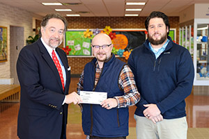 Mr. Clint Walters (receiving the check) and Mr. Shane Grim were recently presented with the PARSS STEM Grant award check by Dr. Ioannidis. 