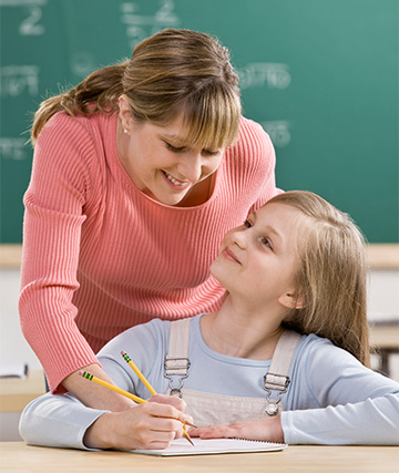 teacher helping a student