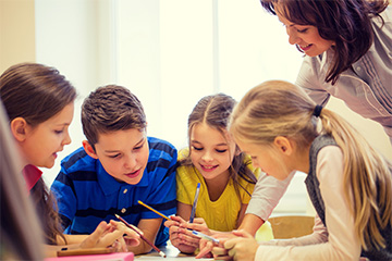 Teacher working with students