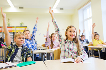 students raising their hands