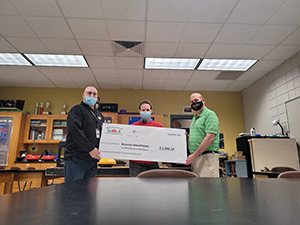 Scott Newell (assistant principal), Dr. Mike McNally (teacher), Eric Hewitt (principal)