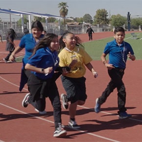group of students running on the track