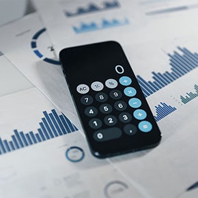 calculator on top of bar graphs