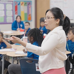teacher in front of classroom teaching