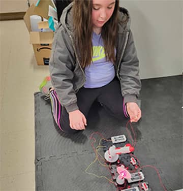 Student working on a robot