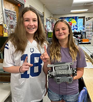 Two female students smiling