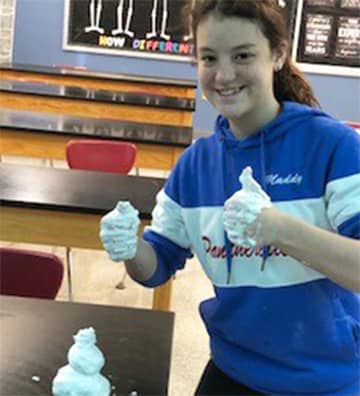 Student playing with shaving cream