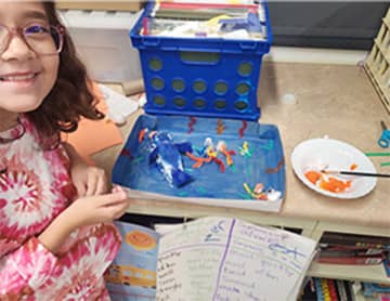 Student showing her project