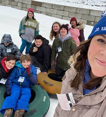 Students sledding in the snow