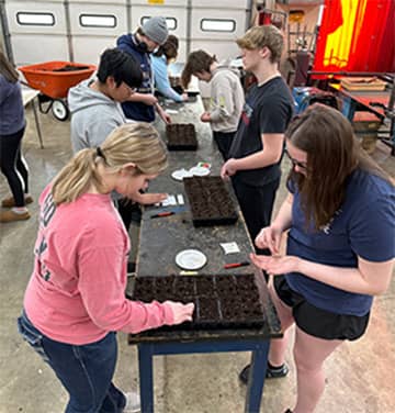 Students planting seeds