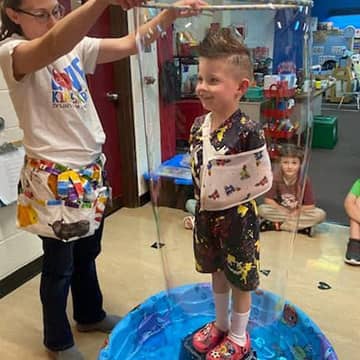 student standing in a bubble