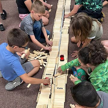 Students working with wooden blocks
