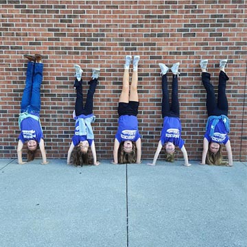 Students doing handstands