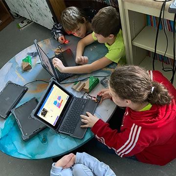 Students working together on laptops