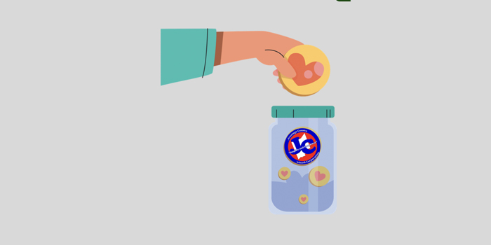 Fundraising concept of a hand dropping hearts in to a jar