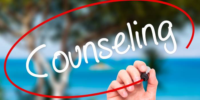 Hand drawing a red circle around the word counseling