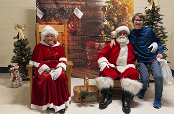 Student with santa and mrs clause