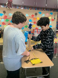 Student building a prosthetic leg