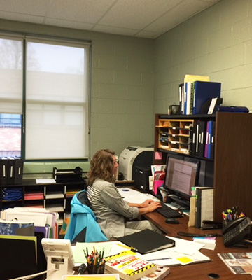 Staff member working in her office