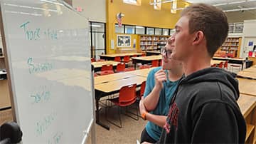 Student looking at a whiteboard