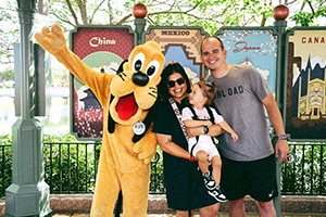 Madalyn Cardinal at disneyland with Goofy and her family