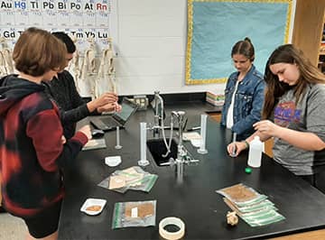 students working with lab instruments