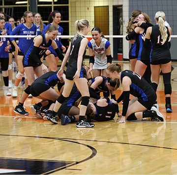 volleyball players celebrating