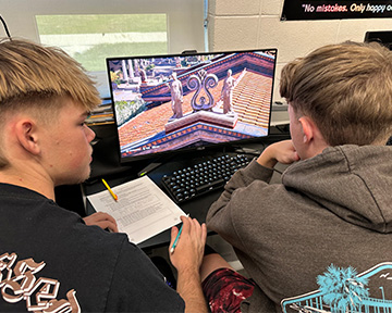 two students sharing a computer