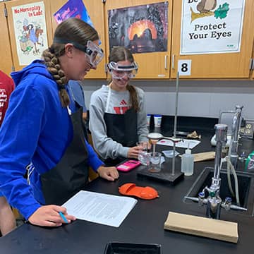 students working on a science experiment