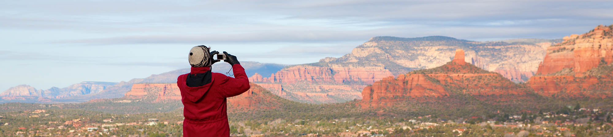 A hiker in a red jacket enjoying the Arizona view