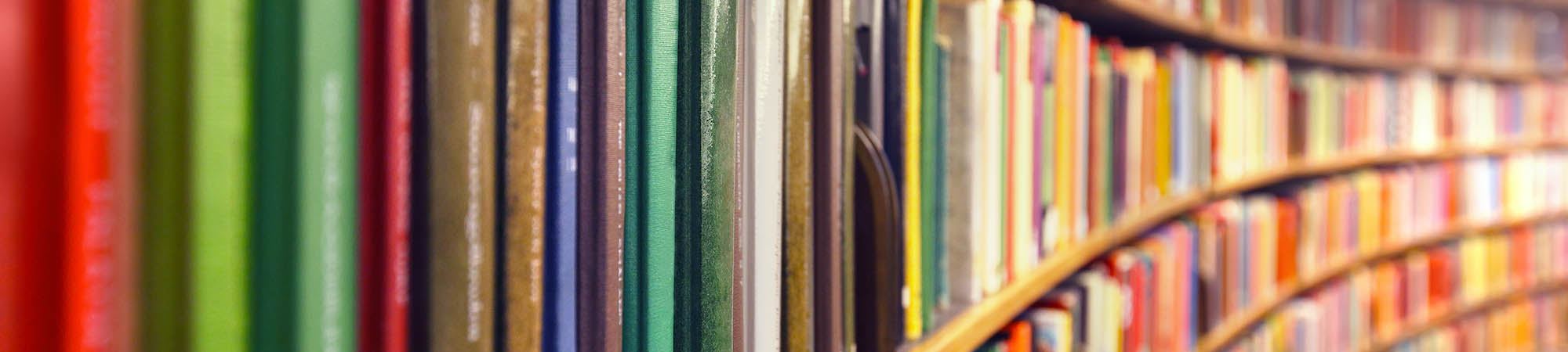 Rows of colorful books in  a library