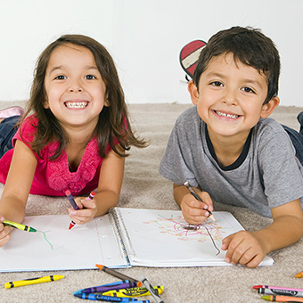 Two happy elementary students smiling for the camera