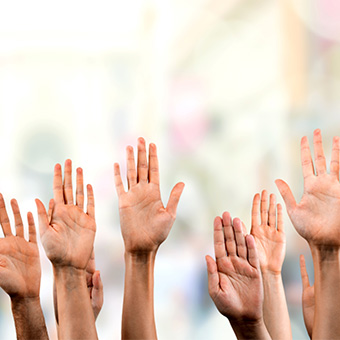Adult hands up in the air