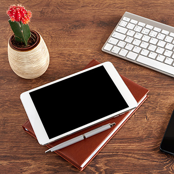 Desk with tablet computer and keyboard