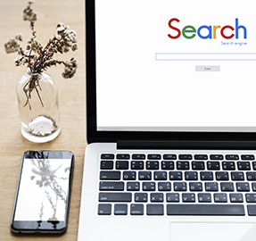 laptop with Google search screen on display