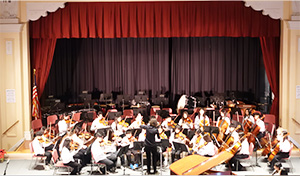 School orchestra performing on stage