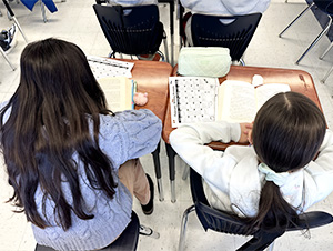 Girls working at their desk