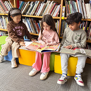 Three students reading books