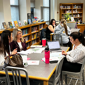 Teachers working together in the library